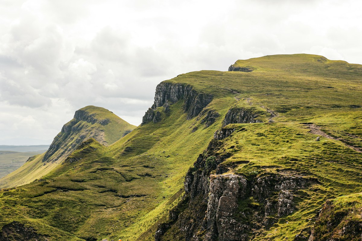 Green slopes and a winding road in the Quiraing, Scotland