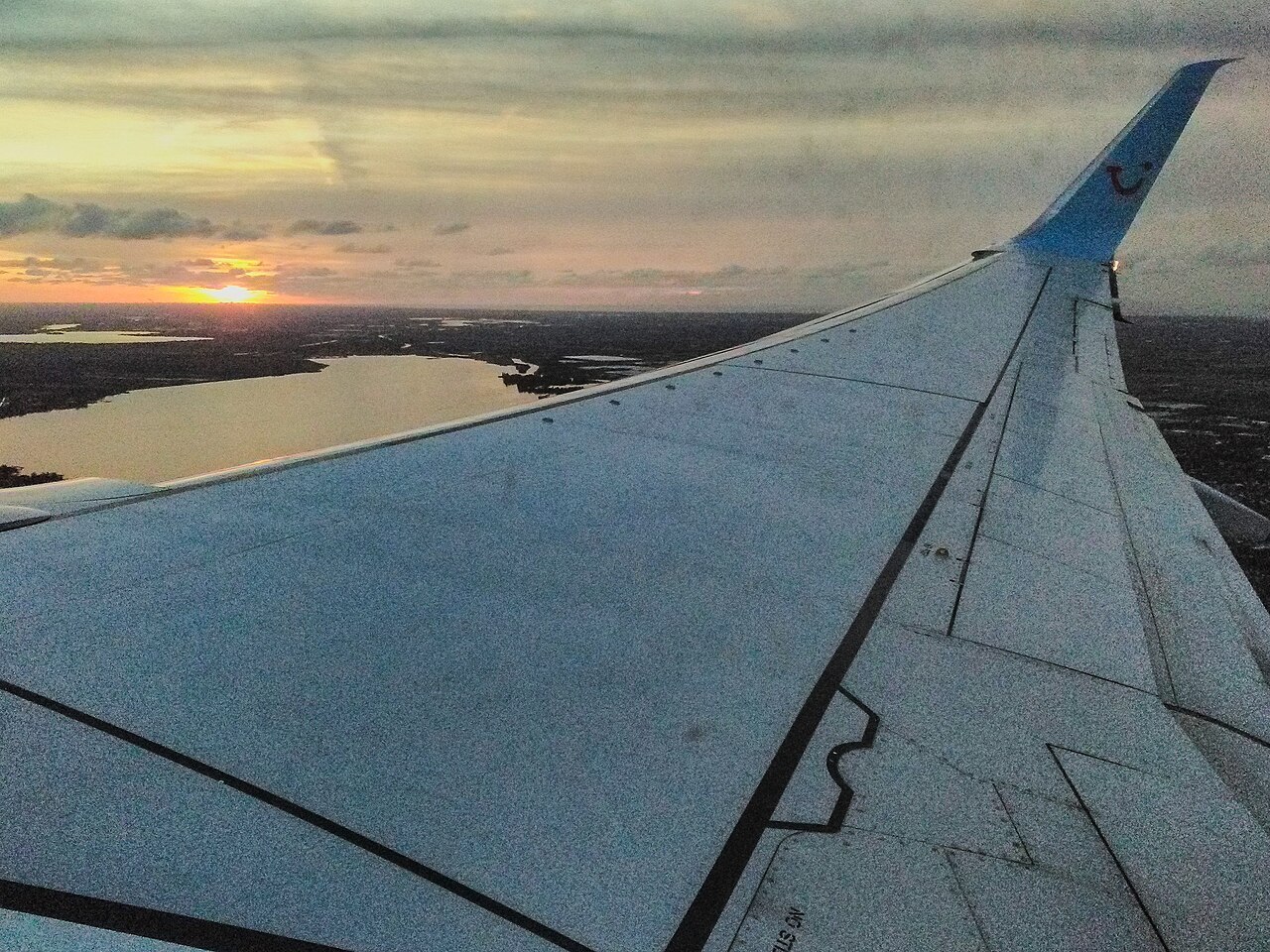 Sunset and wing of a airplane